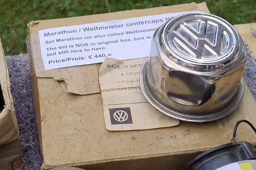 New old stock wheel center caps in box